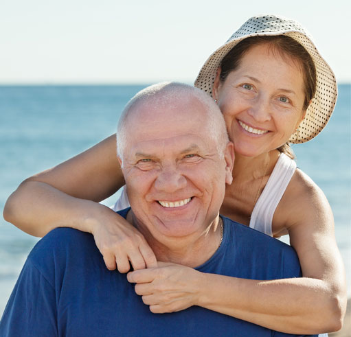 older couple with fixed prosthodontics bridge